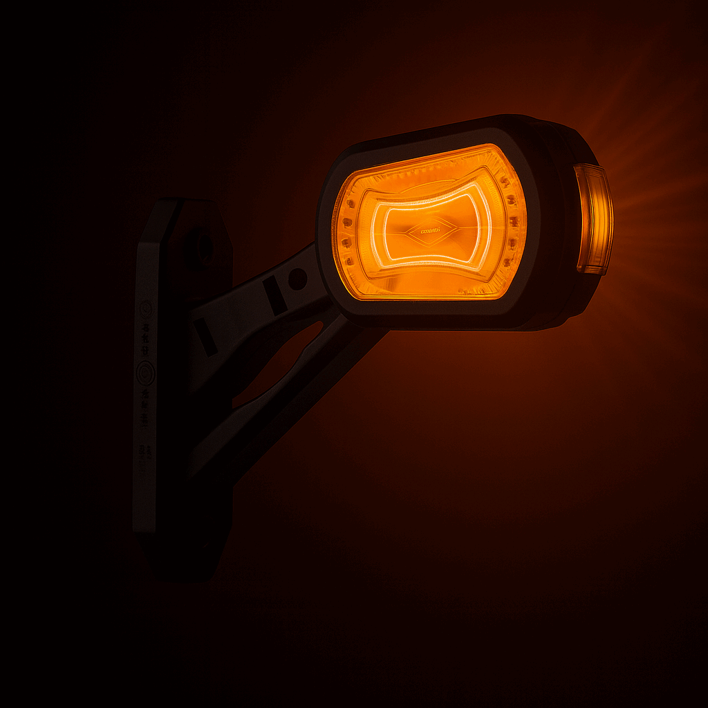 Amber LED outline marker light emitting light on a dark background