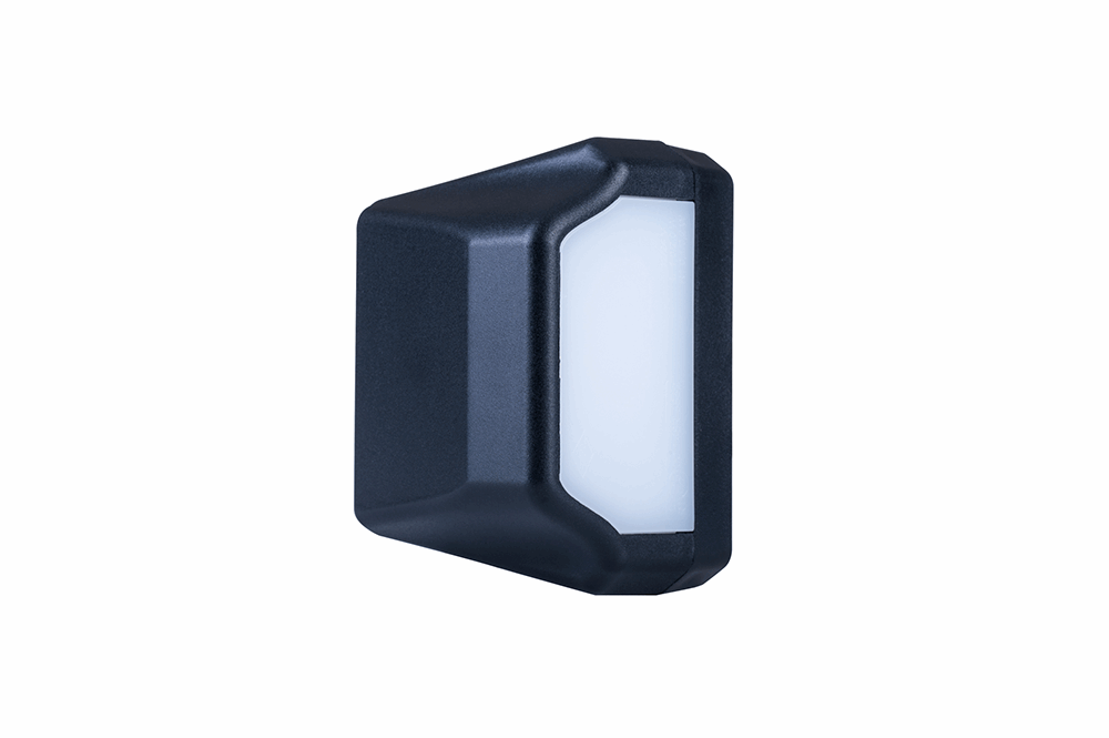 Black rectangular license plate light on a white background