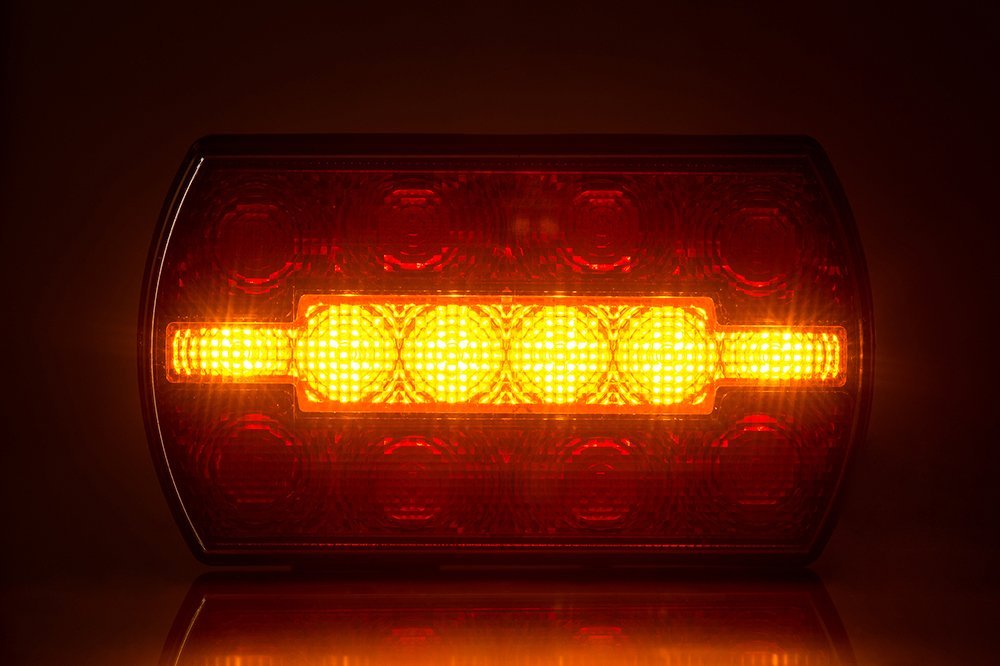 3 Function Rear LED Light Carla LZD 2791 showing illuminated brake and indicator lights in amber and red colors.