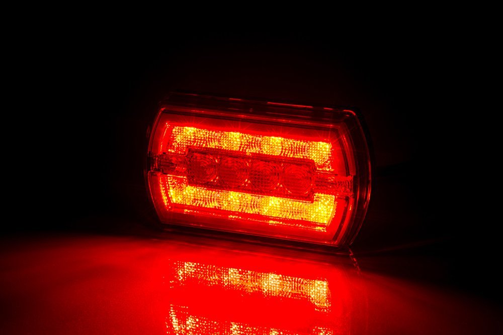 Multifunction Rear LED Light Cleo LZD 2790 glowing red, showing position and brake light functions in dark.