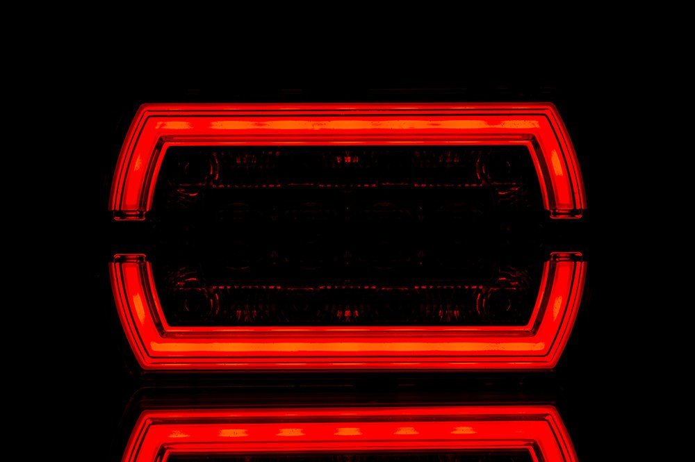 Multifunction Rear LED Light Cleo LZD 2790 showing bright red neon-style position and brake light in dark background.