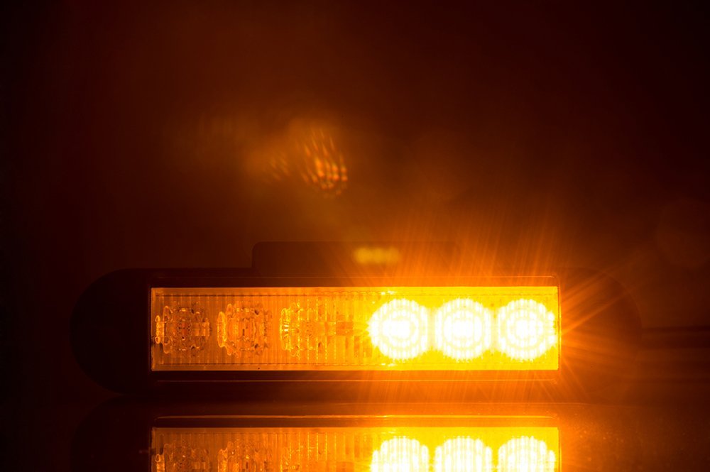 Amber LED Flashing Warning Light LDO 2780 showing bright amber LEDs with high visibility in dark conditions.