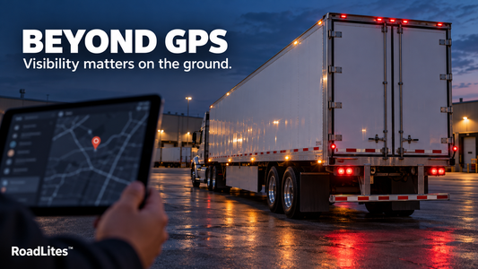 RoadLites “Beyond GPS” graphic showing a tablet with a GPS map beside a semi-trailer with illuminated outline and marker lights in a truck yard at dusk.