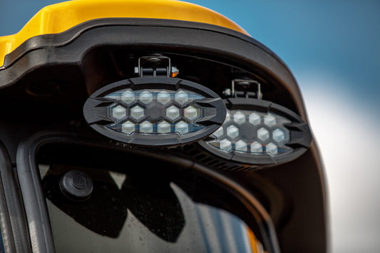 Two durable RoadLites LED work lights for trucks, trailers, farm equipment and heavy machinery.