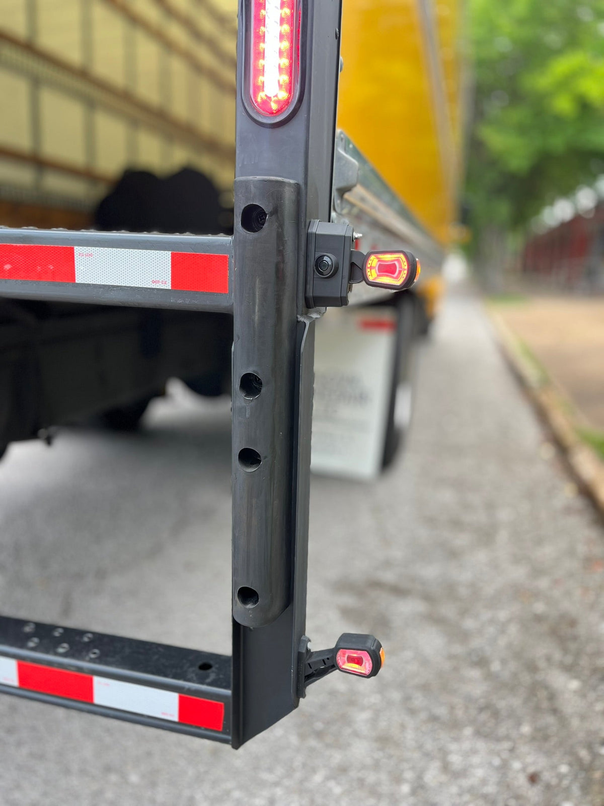 RoadLites reverse motion sensor light LDCC 2794 and stalk arm outline marker light LDCC 2696 mounted on box truck