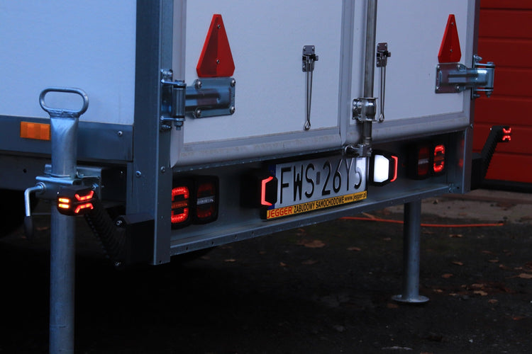 RoadLites LED License Plate Lamp With Position Light LTD 2834 mounted on trailer illuminating license plate