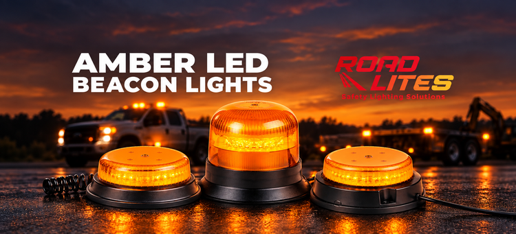 RoadLites amber LED beacon lights with work trucks at dusk