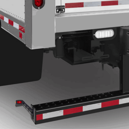 Close-up of a trailer bumper, showing roadlites contour marker lights installed.
