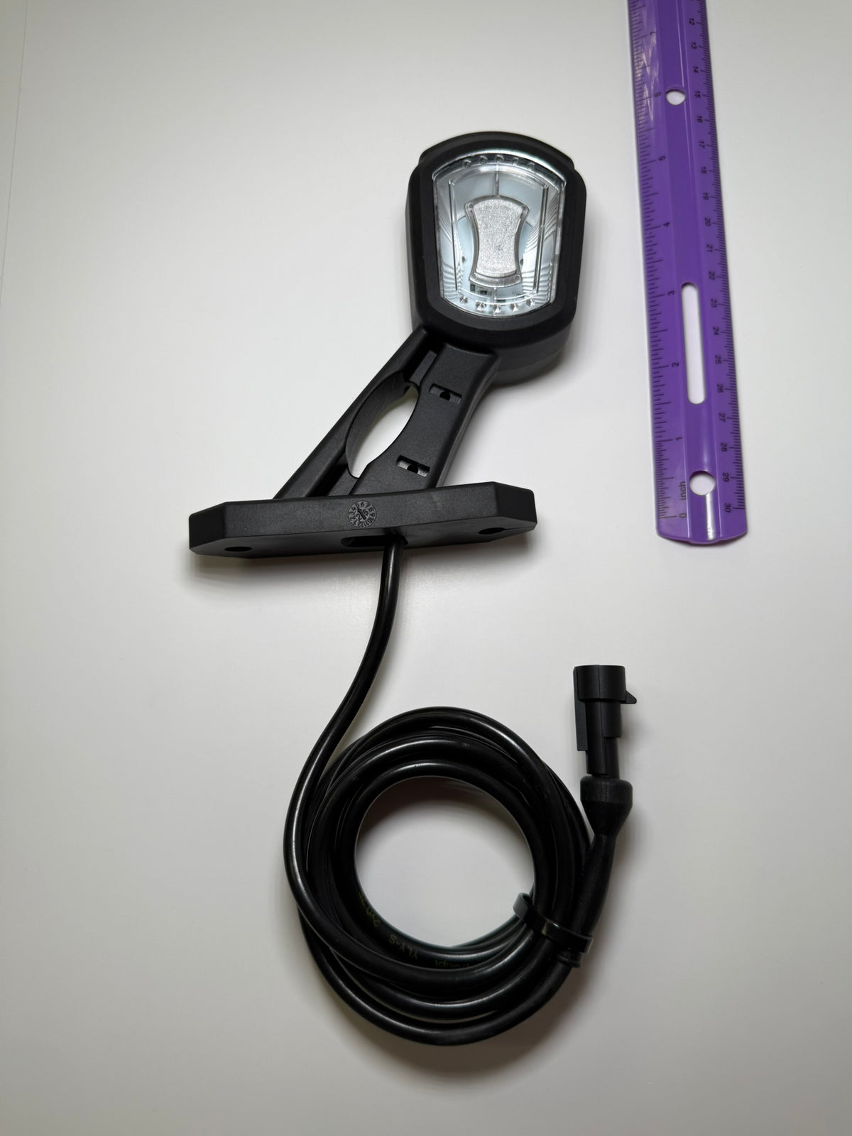 RoadLites right LED Side Outline Marker Light LDCC 2697 with superseal connector compared to a ruler