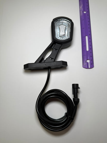 RoadLites right LED Side Outline Marker Light LDCC 2697 with superseal connector compared to a ruler