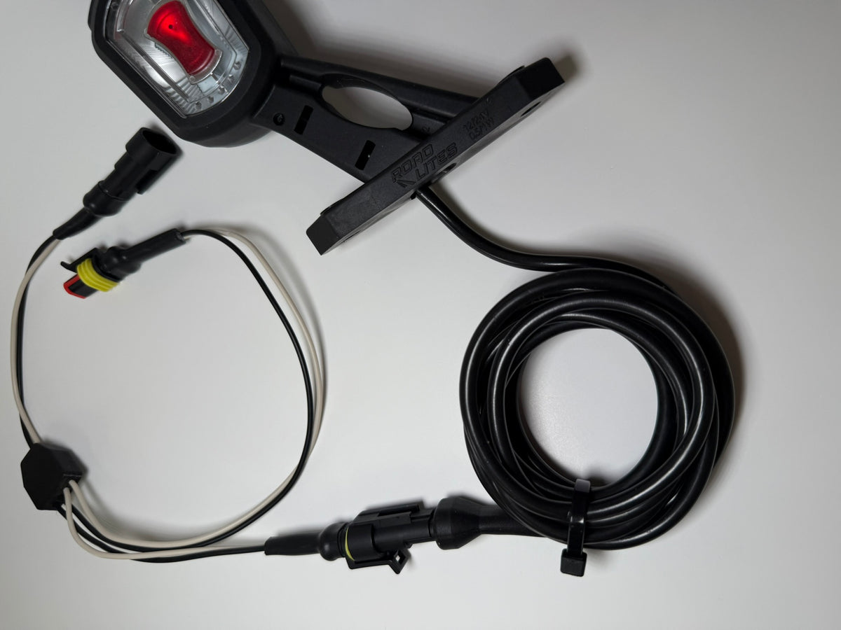 Close up of RoadLites right LED Side Outline Marker Light LDCC 2697 with superseal connector and superseal harness