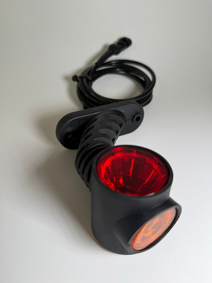 Close up of 1 left side RoadLites Triple LED Auxiliary Side Arm Outline Marker Light LD 2181 with red rear marker light