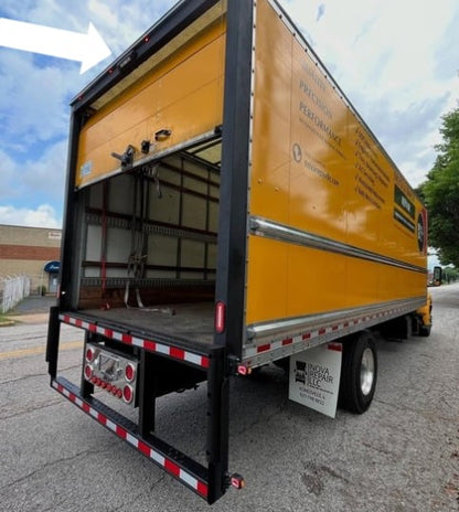 LED Work Light (6500 K) RL 3042/BLACK mounted on the top rear corner of a yellow box truck.