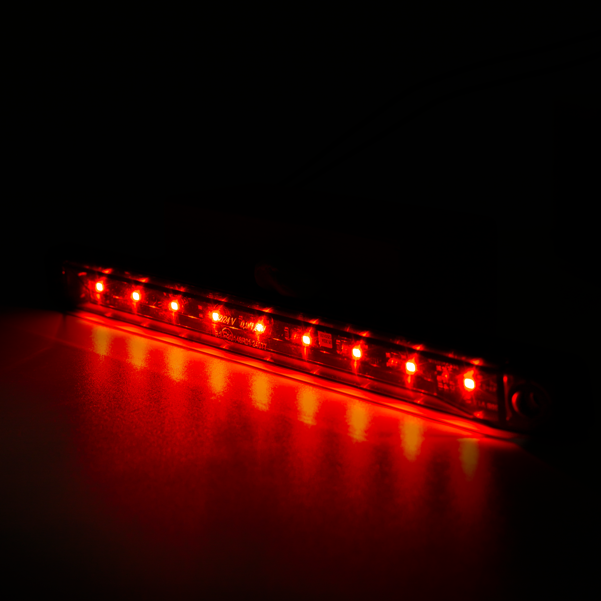 Red LED light bar glowing on a dark background