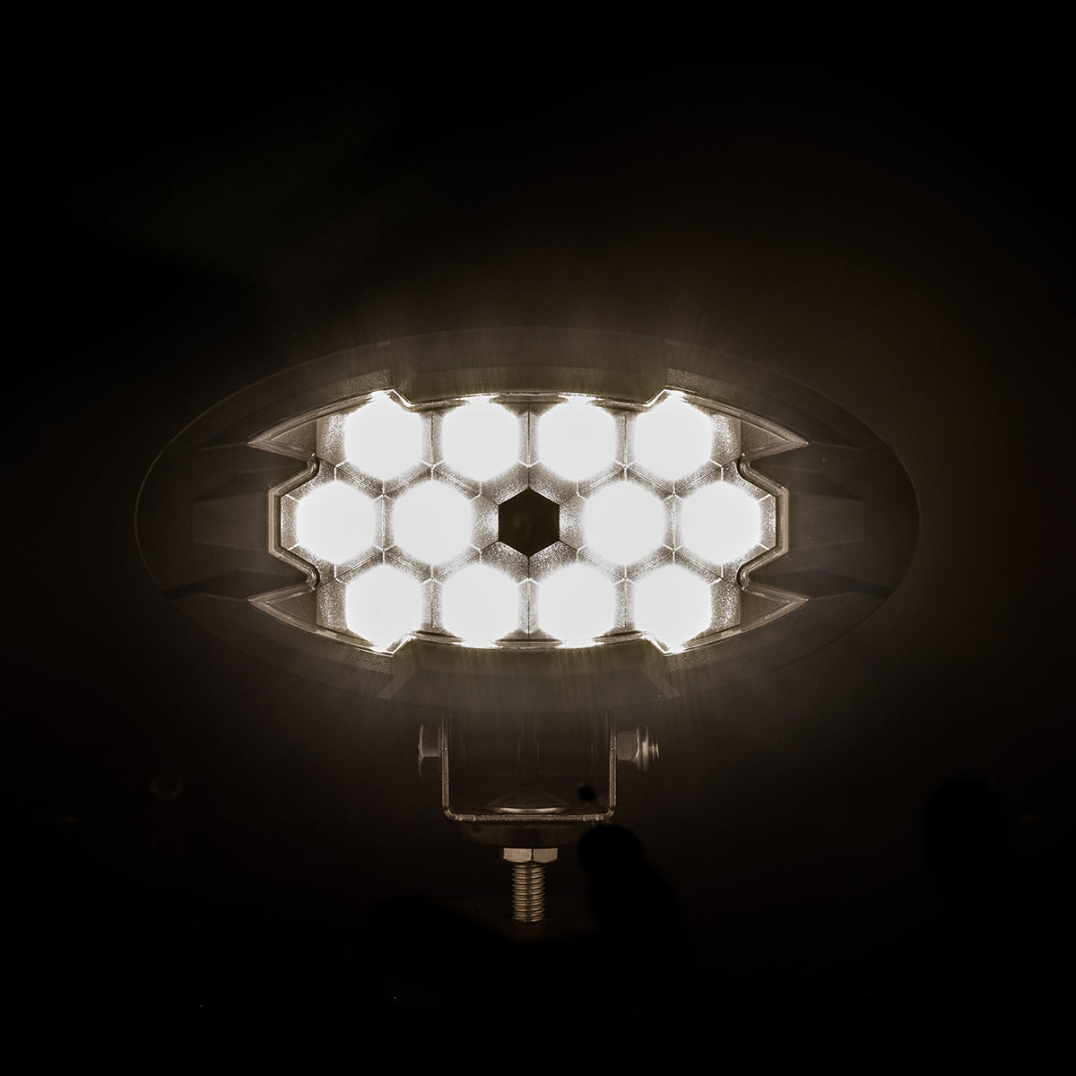 Oval LRD 3160 RAPTOR LED work light glowing, 5500-lumen 12-LED auxiliary lamp for trucks, agricultural, construction equipment, and off-road vehicles