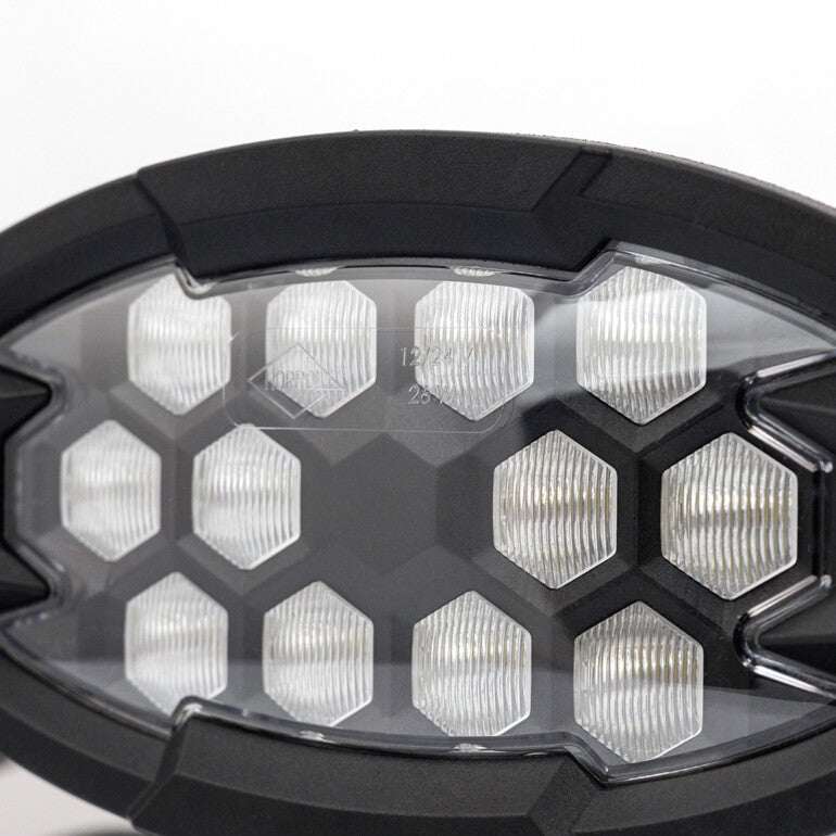 Work light RAPTOR (dispersed light, 2500 lm) LRD 3161 showing clear hexagonal lens pattern in black frame close-up view