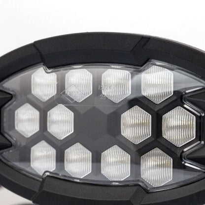Work light RAPTOR (dispersed light, 2500 lm) LRD 3161 showing clear hexagonal lens pattern in black frame close-up view