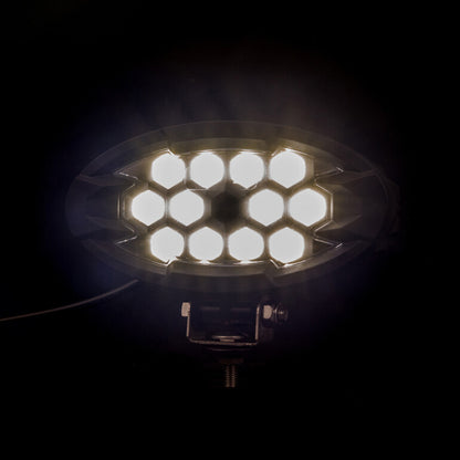 Work light RAPTOR (dispersed light, 2500 lm) LRD 3161 bright white LEDs arranged in hexagonal cluster glowing in dark background