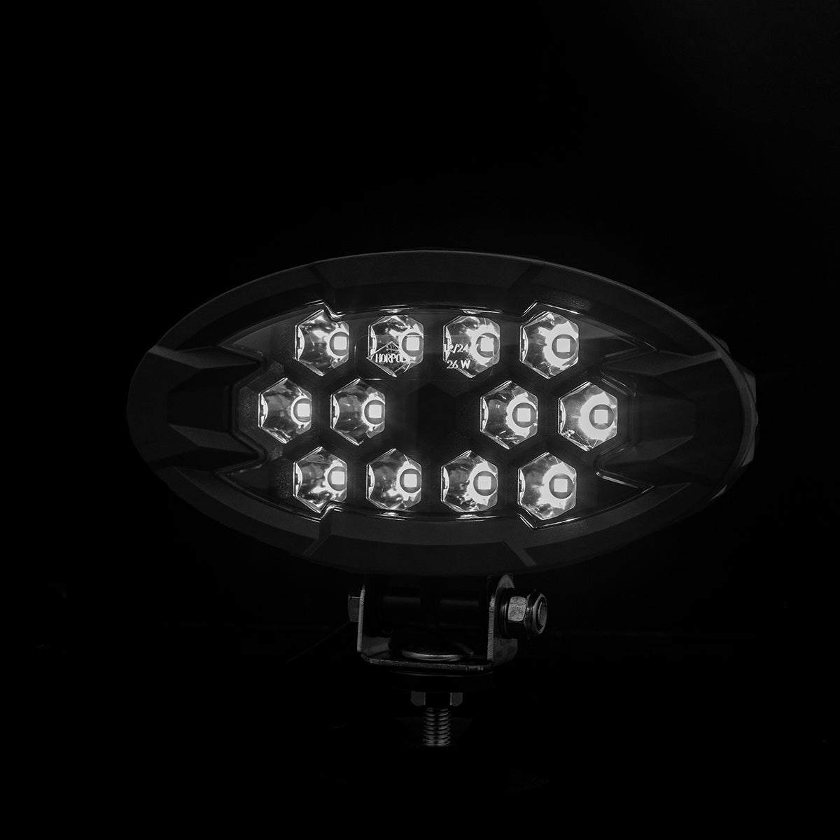 Work lamp RAPTOR (focused light, 2500 lm) LRD 3167 showing illuminated hexagonal LED array with mounting bracket against black background