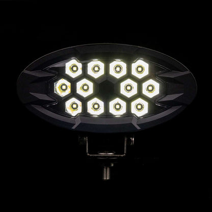 Work light RAPTOR (focused light, 5500 lm) LRD 3169 showing illuminated hexagonal LED clusters in oval housing with metal mounting bracket