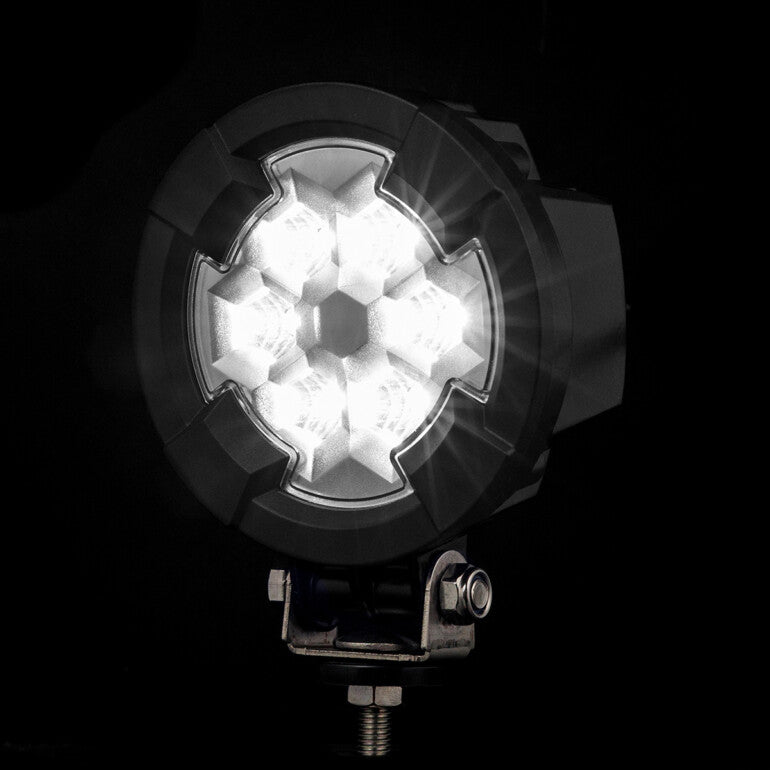 Work light RAPTOR (dispersed light, 2600 lm) LRD 3180 illuminated hexagonal LED array in black housing with mounting bolt visible