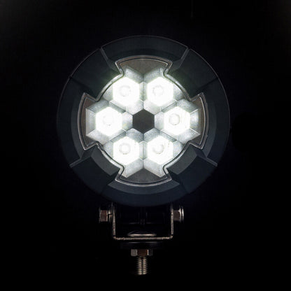 Work light RAPTOR (dispersed light, 2600 lm) LRD 3180 illuminated hexagonal LED cluster with black mounting bracket visible