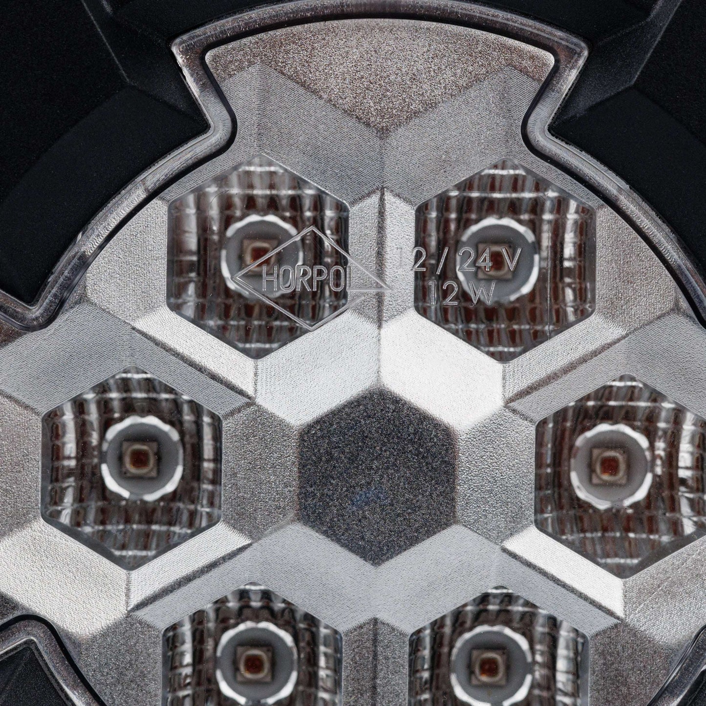 Work light RAPTOR (dispersed light, 650 lm) LRD 3188 close-up of hexagonal LED pattern with clear lens and textured reflectors