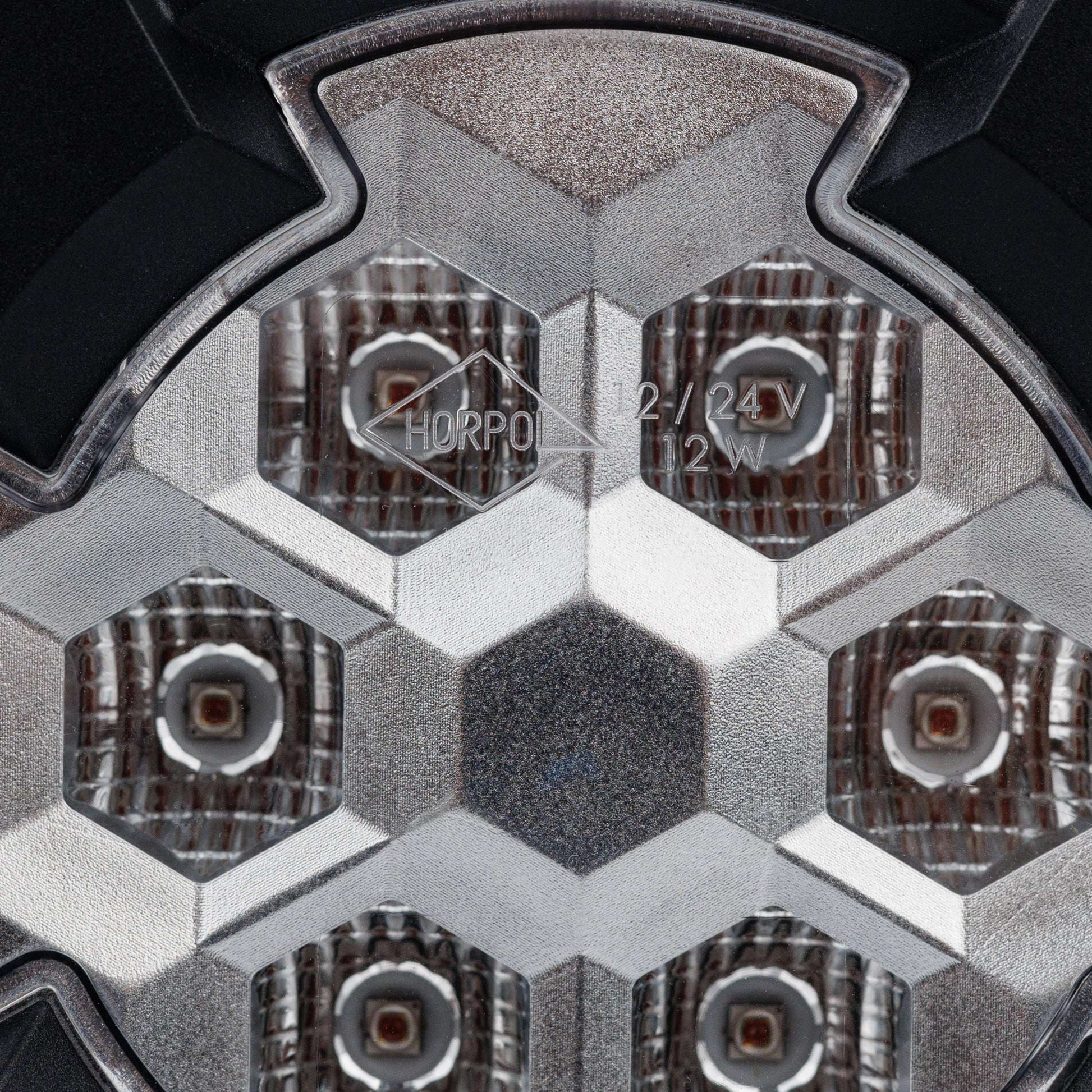 Work light RAPTOR (dispersed light, 650 lm) LRD 3188 close-up of hexagonal LED pattern with clear lens and textured reflectors