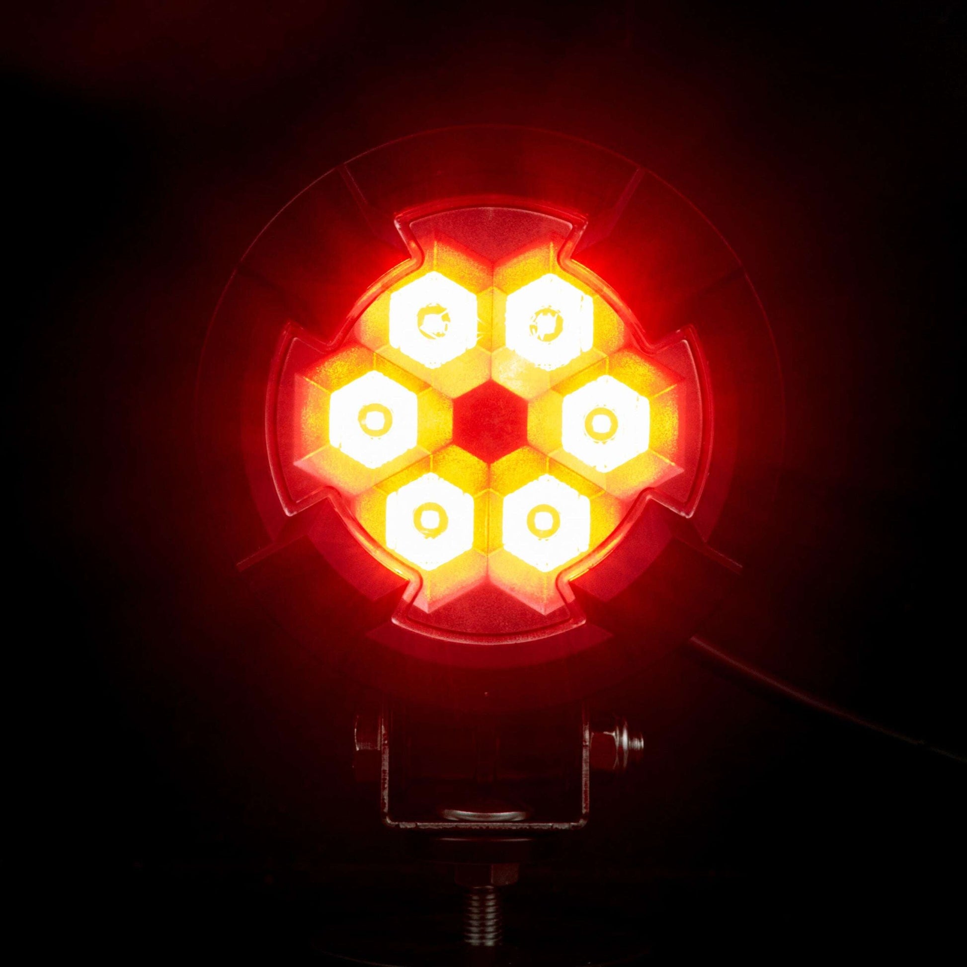 Work light RAPTOR (dispersed light, 650 lm) LRD 3188 showing six bright amber LED clusters illuminated on black mounting bracket