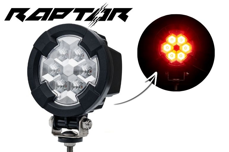 Work light RAPTOR (dispersed light, 650 lm) LRD 3188 showing seven amber LED clusters glowing bright on black housing with mounting bracket