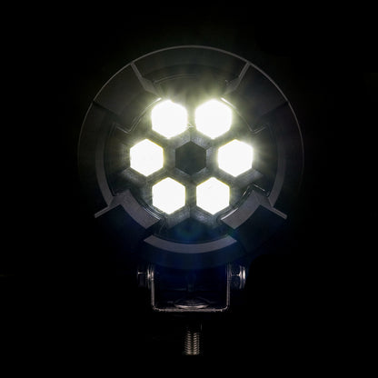 Work light RAPTOR (focused light, 2600 lm) LRD 3189 showing six bright hexagonal LED modules illuminated in dark background