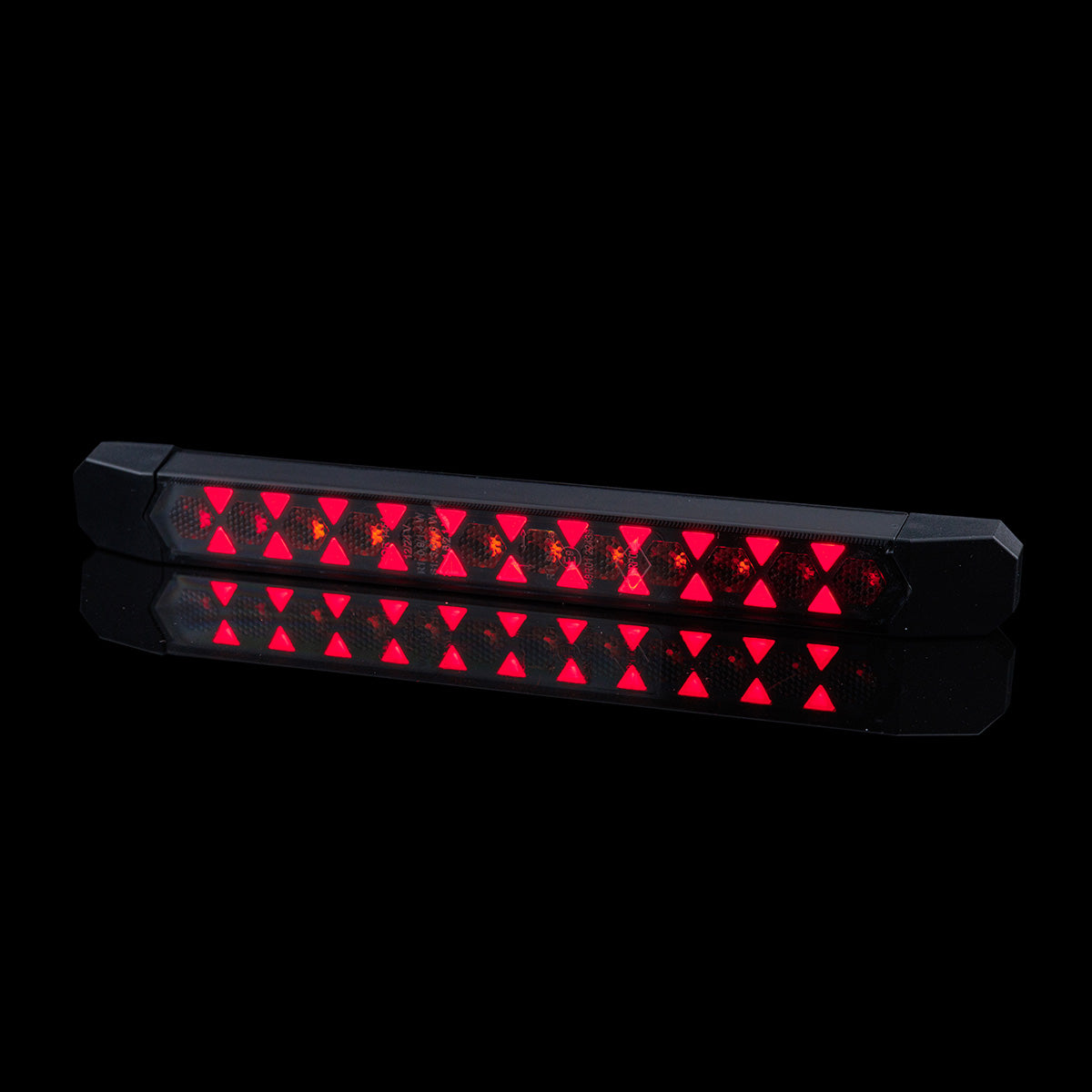 Rear Multifunction Amber and Red LED Light With Static Direction Indicator LIZARD LZD 3140 showing bright red LEDs on black background.