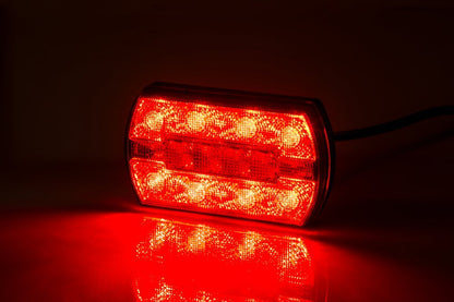 3 Function Rear LED Light Carla LZD 2791 showing bright red illuminated LED rear position, brake, and indicator light.